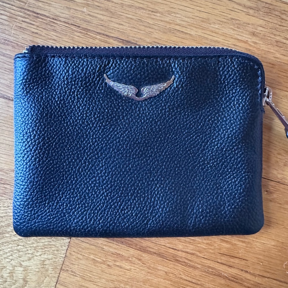 Black leather wristlet by Zadig & Voltaire.
